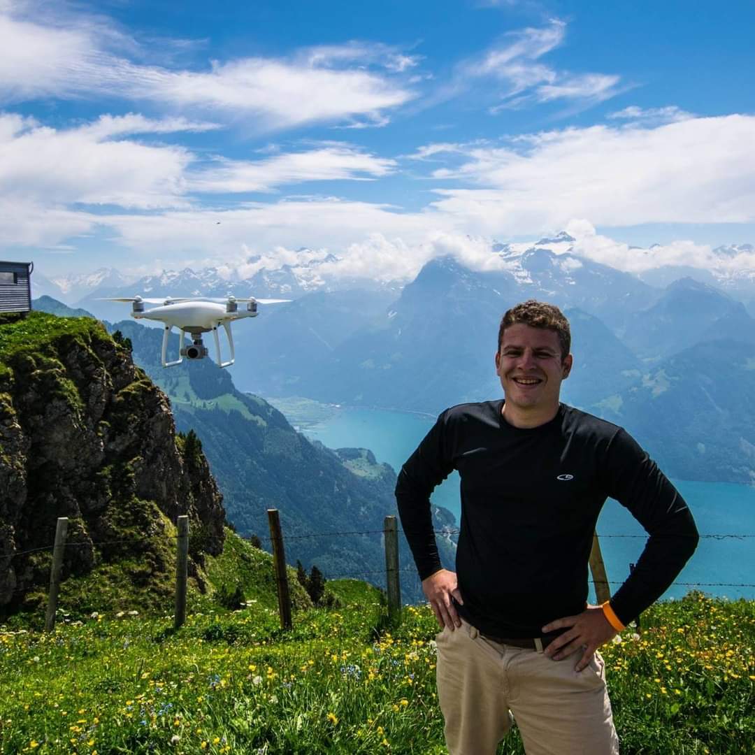 Derek posing with his DJI Phantom in the Swiss Alps